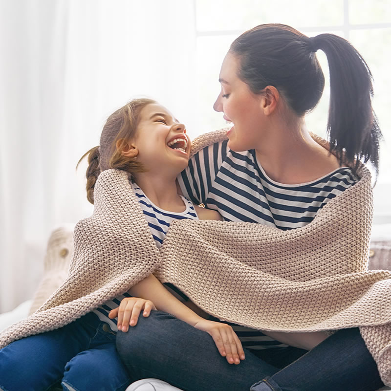 Mother laughing with her child