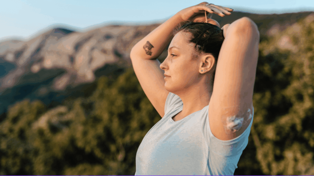 woman outside tying her hair up