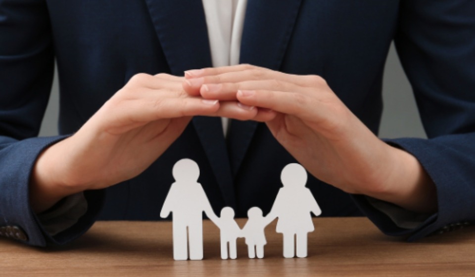 paper cutout of family